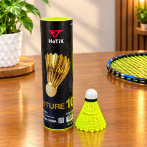 Badminton shuttlecock beside a black tube and bright yellow-green shuttle