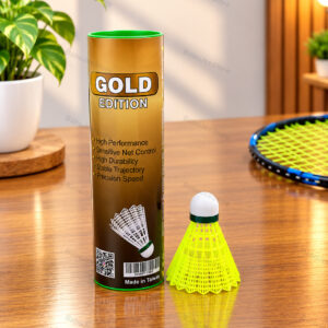 Badminton shuttlecock beside a gold-coloured tube and green shuttlecock