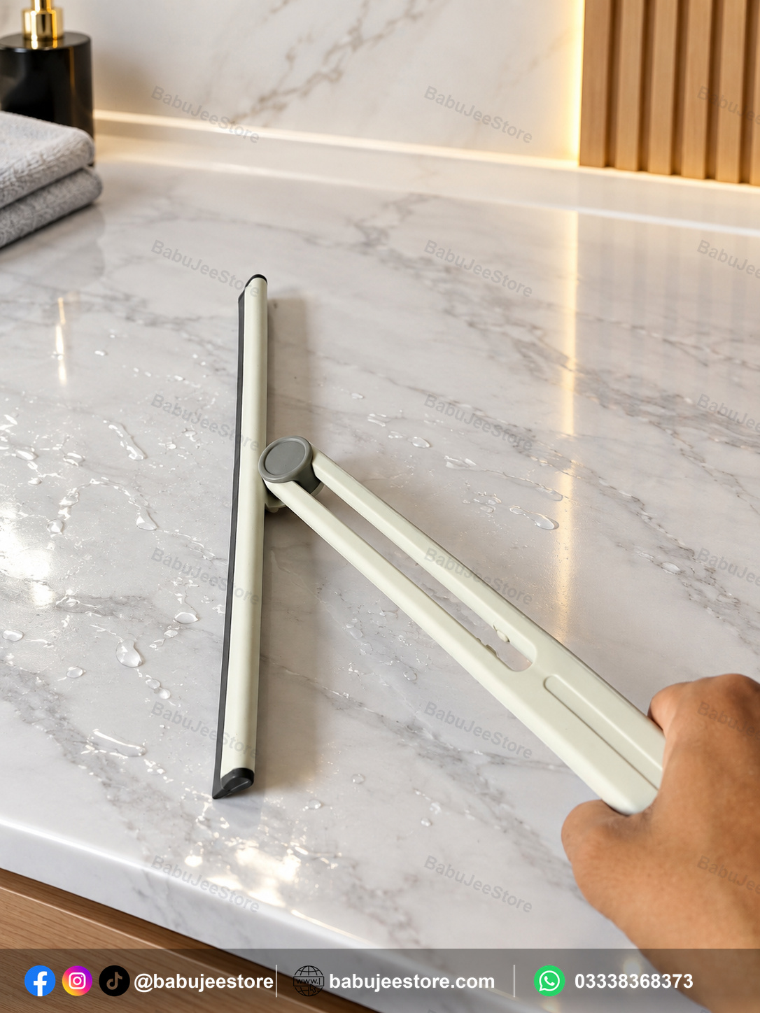 Compact floor squeegee shown with its hinged handle Compact floor squeegee shown with its hinged handle